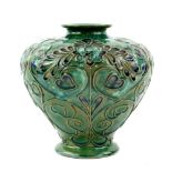 Doulton stoneware vase with Art Nouveau style decoration of heart form leaves and flowers,