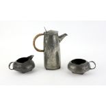 Archibald Knox for Liberty & Co, a Tudric pewter, three piece coffee service with decoration of