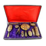 Tortoiseshell and horn dressing table set with gilt decoration of with Chinese dragons, original