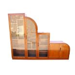 Art Deco, mahogany bookcase cabinet, with three glazed doors enclosing fixed cube shelves, and a