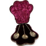 Set of three Victorian silver sifter/berry spoons with figural terminals, moulded stems and engraved