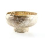 White metal hammered bowl on round foot, (unfinished), weighs 31oz, 964g.