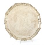 George VI silver salver with serpentine border, on three scroll feet, by Viner's Ltd., Sheffield,