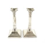 Pair of George V silver Corinthian column candlesticks, by Robert Pringle & Sons, London, 1914, 21.