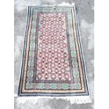 Turkoman cream ground rug with multiple borders, the centre with rows of guls, 180cm x 80cm .