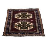 Kazak Caucasian red ground rug the centre with twin octagonal medallions 184cm x 144cm .