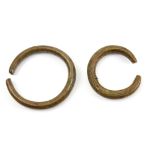 Two antique engraved bronze bracelets, in the form of snakes, largest 10cm diameter..