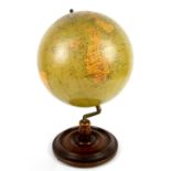 Philips terrestrial globe, on wooden pedestal base, 14 in. high .