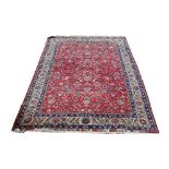 Persian style rug the red ground with birds amongst flowering branches within multiple borders 294cm