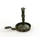 Bronze miniature pricket stick, the base with scrolling decoration, on dish form stand with