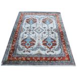 Persian type cream ground rug with multiple borders, the centre with shaped medallions, 260cm x