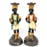 Pair of painted Venetian Blackamoor candlesticks on circular bases, circa 1900, 42cm high.