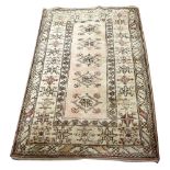 Persian type cream ground rug 162cm x 110cm.