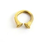 Gilt bronze penannular ring or fastener with trumpet terminals, possibly European Late Bronze Age,