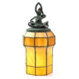 Set of seven early 20th century slag glass and leaded lanterns, of stepped hexagonal form the bronze