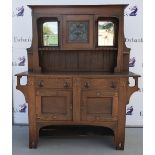 Oak Arts and Crafts sideboard, the central cabinet with central leaded glass, copper finish studs