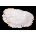 German porcelain dish, the asymmetrical gilt border surrounding a female face with flowing hair,