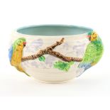 Clarice Cliff for Newport pottery bowl decorated with brightly coloured parrots in relief, printed