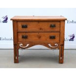 Arts and Crafts small oak chest of two drawers, with pierced decoration 79 x 92 cm, depth 44 cm .