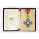 CHANGE OF DESCRIPTION Replica CBE medal with ribbon in George V period case fitted case.