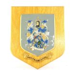 Greyfriars School coat of arms carved and painted on a wooden plaque with the motto 'Conamur