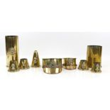1914 brass shell case formed into a Royal Artillery cap, 1917 brass shell case formed into a Machine