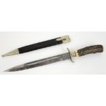 F. Herder steel bladed dagger with antler handle in leather and metal sheath.