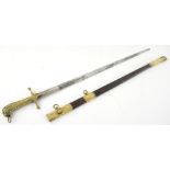 19th century sword with brass hilt with lion pommel, blade 74 cms, leather and brass scabbard.