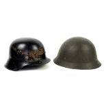 Collection of eight miscellaneous military and other helmets .