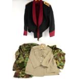 Collection of military uniforms belts and related items . width across shoulder of mesh jacket shown