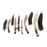 Three kukri's in leather scabbards the largest 44cm, and two daggers. .