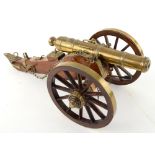 Scale model of a field gun or cannon, brass barrel and furniture on an oak carriage, 51cm.