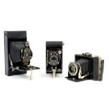 Collection of cameras and photographic accessories .