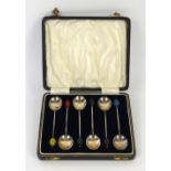 Set of George V multicoloured bean-topped silver coffee spoons, in fitted case, Birmingham, 1932,