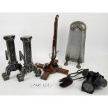 Pair of cast metal fire dogs, a lamp in the form of a pistol and other items, Mrs Beaton and other