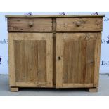 A stripped pine sideboard of two short drawers over cupboard doors, and another sideboard. (2)