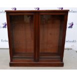 Mahogany bookcase and a mahogany wardrobe of four cupboard doors