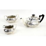 Collection of silver plate to include three piece tea set and a copper fender