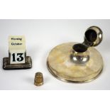 Selection of silver items including Capstan inkwell, pencil, thimble, desk perpetual calendar