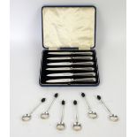 Set of six silver handled knives, in fitted case, and a set of six bean top coffee spoons,