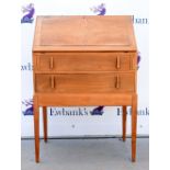 Light walnut fall front bureau over two drawers