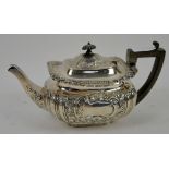 Silver teapot of shaped rectangular form with floral repousse decoration London 1898