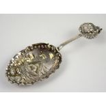 Continental silver caddy spoon with a scene of a fishing boat, import marks for London, 1897,