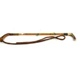 Early 20th century bamboo handled horse whip, a bit and a barometer in the form of a stirrup.