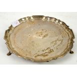 George V silver salver, by F J & S, Sheffield 1932, with scalloped border and on three pad feet,