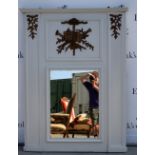 Grey painted overmantel mirror with book and musical instrument decoration highlighted in gilt,