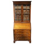 19th century mahogany bureau bookcase, with glazed doors to reveal two drawers and adjustable