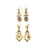 A pair of Victorian gold earrings, the lyre form suspending a garnet set drop, length 5.7 cm,