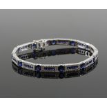 Sapphire and diamond bracelet, set with twelve oval cut sapphires, alternately set with