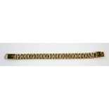 Gold brick link bracelet, two hinged clasps with connecting ring, testing as 18 ct, length 18 cm .